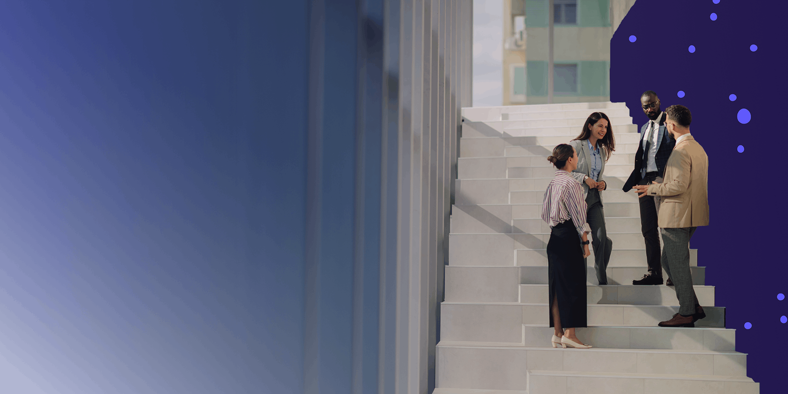 A group of people standing together on a staircase.